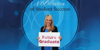 Bridget Cain holding sign that says Future Graduate