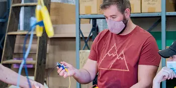 Man working in air, heating lab