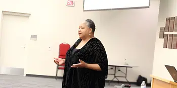Jacqueline Whittenburg standing in front of room