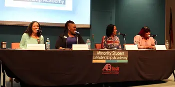 Four women sitting at a table